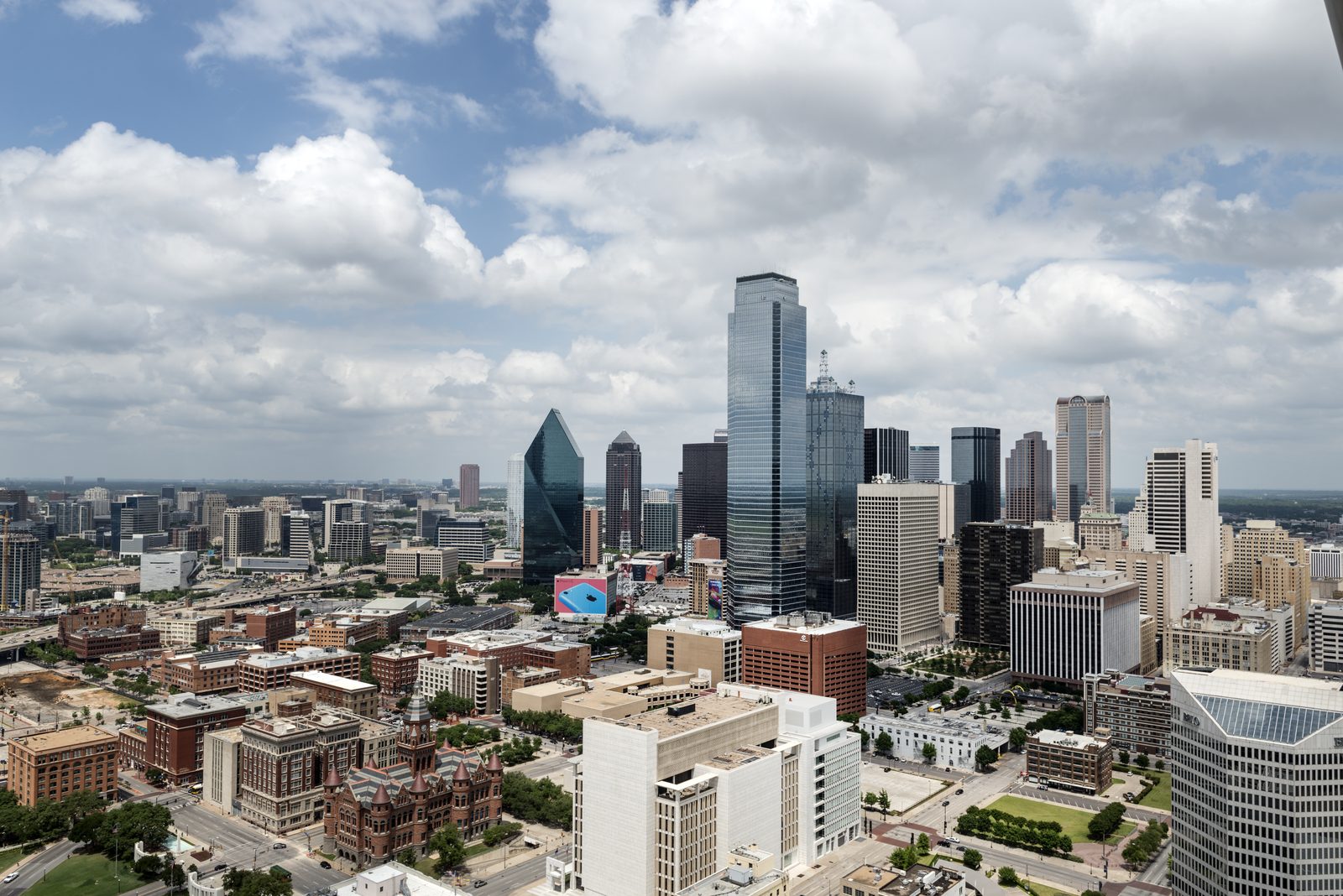 An elevated view of downtown Dallas from Reunion Tower under a clear blue sky